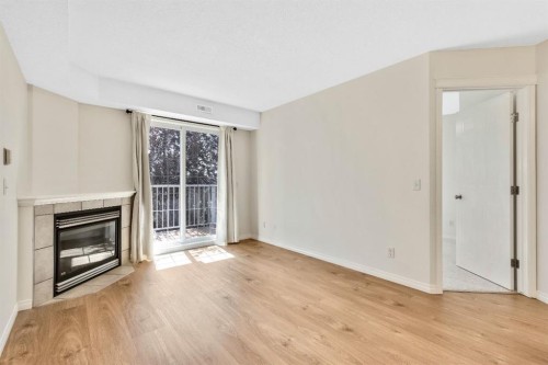 321-103 Strathaven Drive, Strathmore, AB - Indoor Photo Showing Other Room With Fireplace