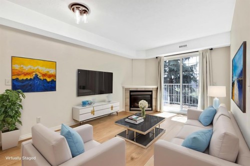 321-103 Strathaven Drive, Strathmore, AB - Indoor Photo Showing Living Room With Fireplace