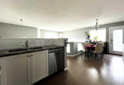 246 Arbour Grove Close Nw, Calgary, AB - Indoor Photo Showing Kitchen With Double Sink