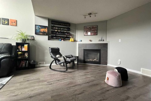246 Arbour Grove Close Nw, Calgary, AB - Indoor Photo Showing Other Room With Fireplace