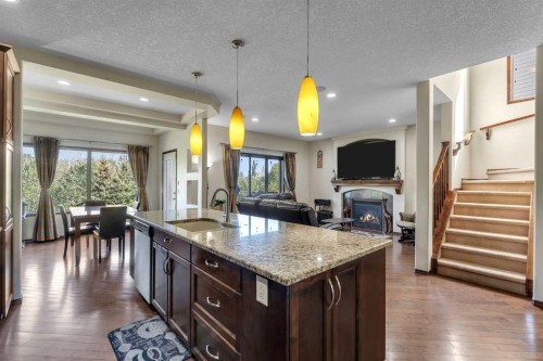 126 Tuscany Summit Heath Nw, Calgary, AB - Indoor Photo Showing Kitchen With Fireplace With Upgraded Kitchen