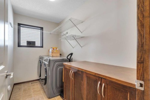 126 Tuscany Summit Heath Nw, Calgary, AB - Indoor Photo Showing Laundry Room
