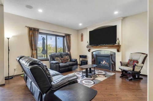 126 Tuscany Summit Heath Nw, Calgary, AB - Indoor Photo Showing Living Room With Fireplace