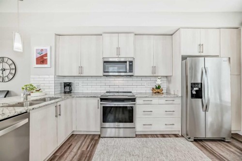 63 Legacy Path Se, Calgary, AB - Indoor Photo Showing Kitchen With Stainless Steel Kitchen With Double Sink With Upgraded Kitchen