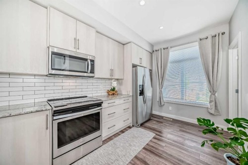 63 Legacy Path Se, Calgary, AB - Indoor Photo Showing Kitchen With Stainless Steel Kitchen With Upgraded Kitchen