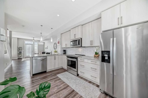 63 Legacy Path Se, Calgary, AB - Indoor Photo Showing Kitchen With Stainless Steel Kitchen With Upgraded Kitchen