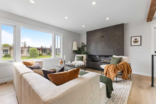 611 Agate Crescent Se, Calgary, AB - Indoor Photo Showing Living Room With Fireplace
