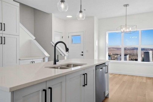 1604-525 River Heights Drive, Cochrane, AB - Indoor Photo Showing Kitchen With Double Sink With Upgraded Kitchen