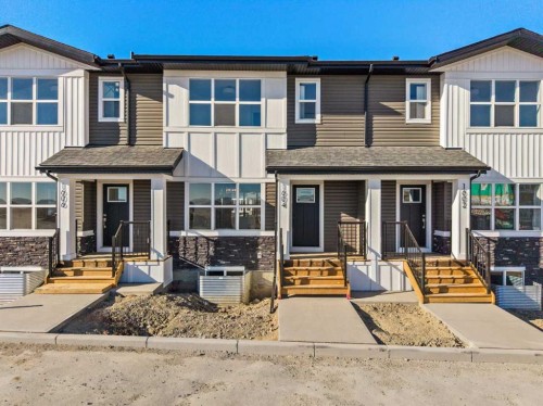 1604-525 River Heights Drive, Cochrane, AB - Outdoor With Facade