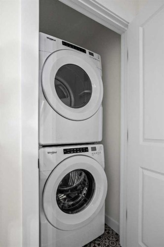 1604-525 River Heights Drive, Cochrane, AB - Indoor Photo Showing Laundry Room
