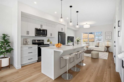 1604-525 River Heights Drive, Cochrane, AB - Indoor Photo Showing Kitchen With Stainless Steel Kitchen With Upgraded Kitchen