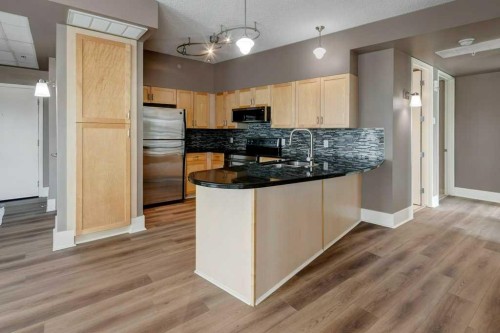 701-205 Riverfront Avenue Sw, Calgary, AB - Indoor Photo Showing Kitchen With Double Sink