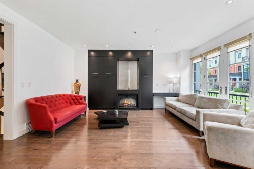 606 Aspen Meadows Hill Sw, Calgary, AB - Indoor Photo Showing Living Room With Fireplace