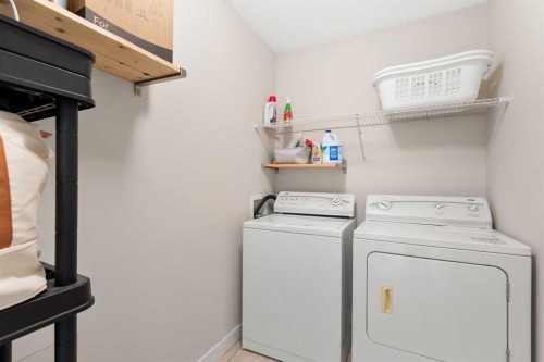 1535 Idaho Street, Carstairs, AB - Indoor Photo Showing Laundry Room