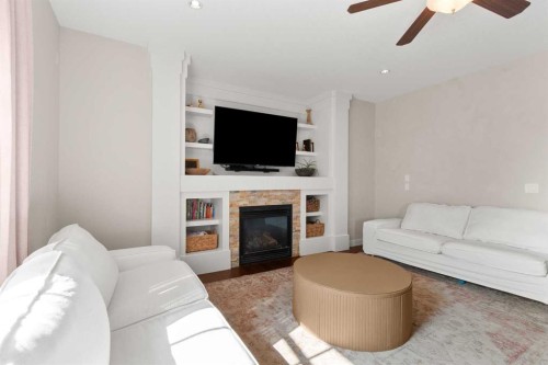 1535 Idaho Street, Carstairs, AB - Indoor Photo Showing Living Room With Fireplace