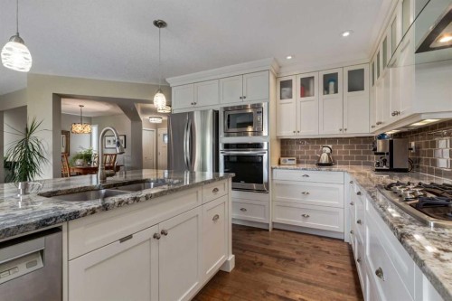 21 Springbank Rise Sw, Calgary, AB - Indoor Photo Showing Kitchen With Double Sink With Upgraded Kitchen