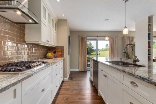 21 Springbank Rise Sw, Calgary, AB - Indoor Photo Showing Kitchen With Double Sink With Upgraded Kitchen