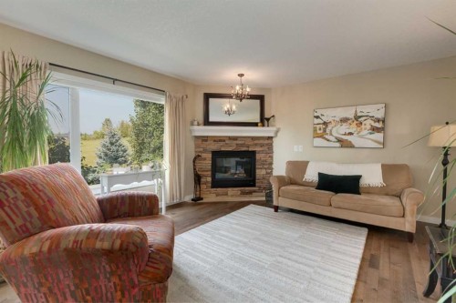21 Springbank Rise Sw, Calgary, AB - Indoor Photo Showing Living Room With Fireplace