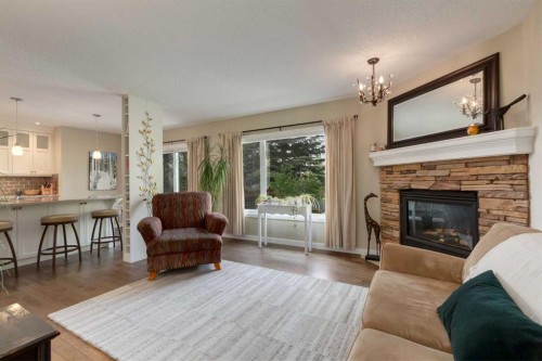 21 Springbank Rise Sw, Calgary, AB - Indoor Photo Showing Living Room With Fireplace