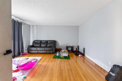 83 Templevale Way Ne, Calgary, AB - Indoor Photo Showing Living Room