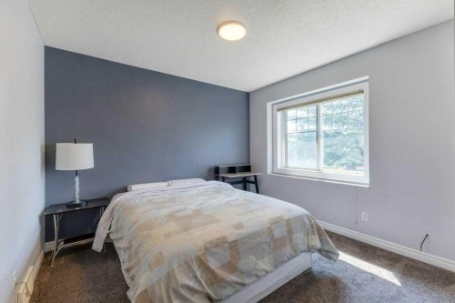 540 Panatella Court Nw, Calgary, AB - Indoor Photo Showing Bedroom