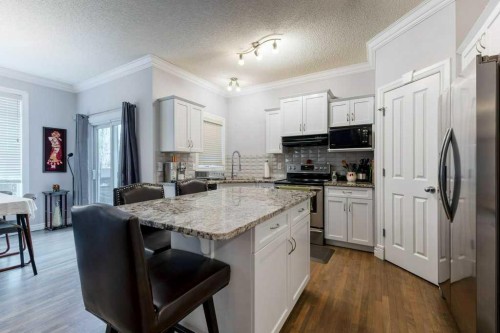 540 Panatella Court Nw, Calgary, AB - Indoor Photo Showing Kitchen With Upgraded Kitchen
