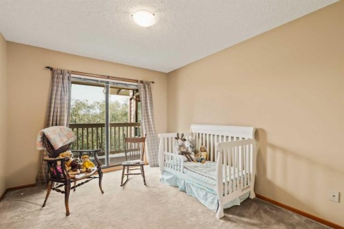 84 Edendale Crescent Nw, Calgary, AB - Indoor Photo Showing Bedroom