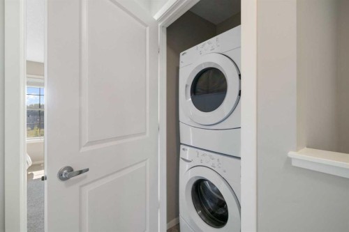 174 Ascot Point Sw, Calgary, AB - Indoor Photo Showing Laundry Room