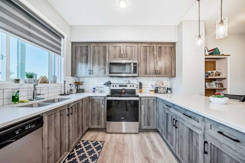 7468 202 Avenue Se, Calgary, AB - Indoor Photo Showing Kitchen With Stainless Steel Kitchen With Double Sink