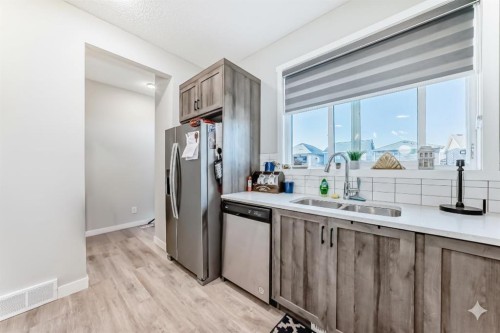 7468 202 Avenue Se, Calgary, AB - Indoor Photo Showing Kitchen With Double Sink