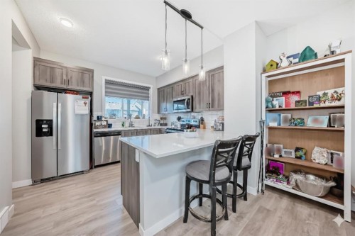 7468 202 Avenue Se, Calgary, AB - Indoor Photo Showing Kitchen With Stainless Steel Kitchen With Upgraded Kitchen