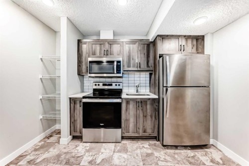 7468 202 Avenue Se, Calgary, AB - Indoor Photo Showing Kitchen With Stainless Steel Kitchen