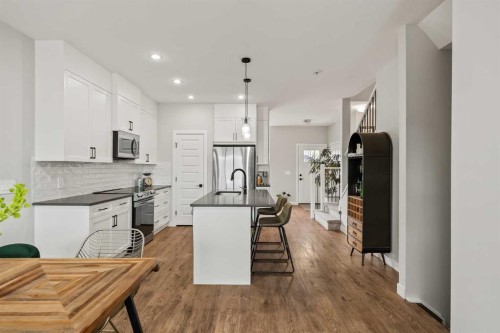 182 River Heights Drive, Cochrane, AB - Indoor Photo Showing Kitchen With Upgraded Kitchen