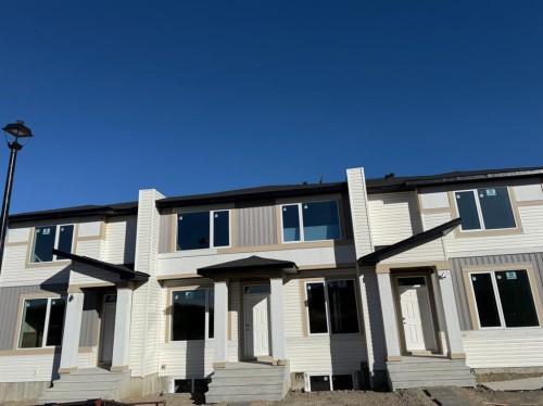 1995 Mccaskill Drive, Crossfield, AB - Outdoor With Facade