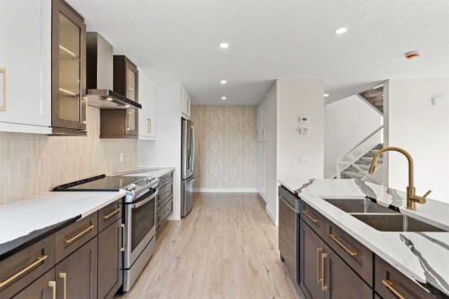 20-1220 Prominence Way Sw, Calgary, AB - Indoor Photo Showing Kitchen With Double Sink With Upgraded Kitchen