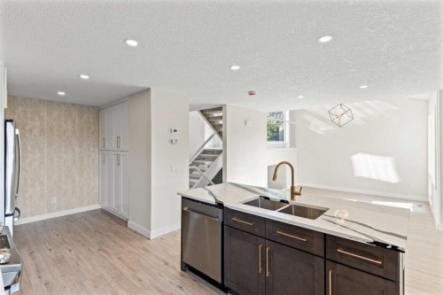 20-1220 Prominence Way Sw, Calgary, AB - Indoor Photo Showing Kitchen With Double Sink