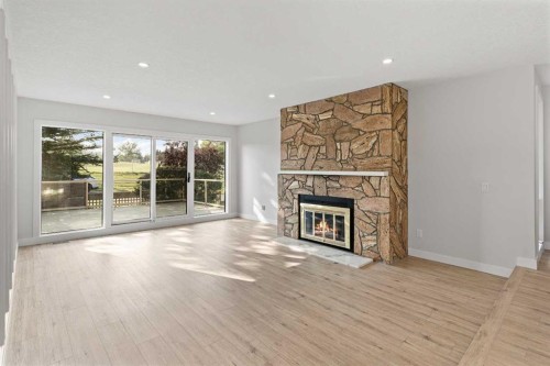 20-1220 Prominence Way Sw, Calgary, AB - Indoor Photo Showing Living Room With Fireplace