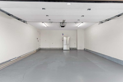 20-1220 Prominence Way Sw, Calgary, AB - Indoor Photo Showing Garage