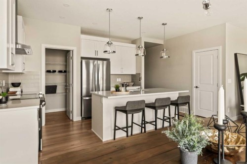 1168 Iron Ridge Avenue, Crossfield, AB - Indoor Photo Showing Kitchen With Stainless Steel Kitchen With Upgraded Kitchen