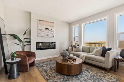 1168 Iron Ridge Avenue, Crossfield, AB - Indoor Photo Showing Living Room With Fireplace