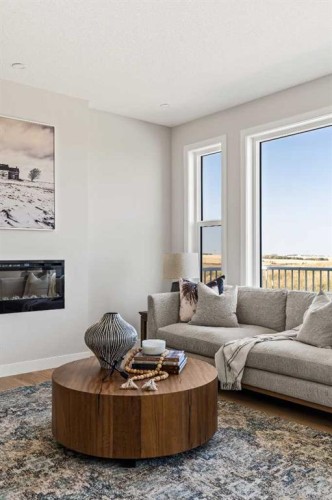 1168 Iron Ridge Avenue, Crossfield, AB - Indoor Photo Showing Living Room With Fireplace