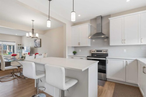 746 Bayview Hill Sw, Airdrie, AB - Indoor Photo Showing Kitchen With Upgraded Kitchen