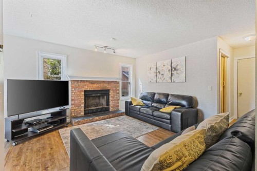 933 Applewood Drive Se, Calgary, AB - Indoor Photo Showing Living Room With Fireplace