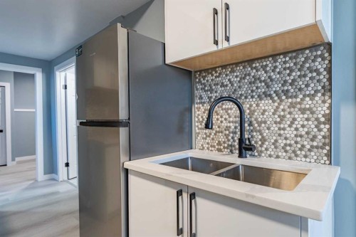 134 Erin Meadow Crescent Se, Calgary, AB - Indoor Photo Showing Kitchen With Double Sink