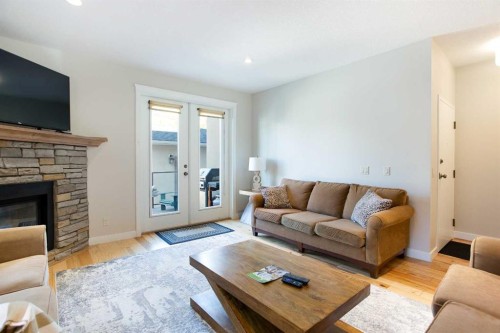 102-814 Memorial Drive Nw, Calgary, AB - Indoor Photo Showing Living Room With Fireplace