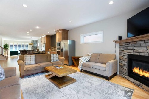 102-814 Memorial Drive Nw, Calgary, AB - Indoor Photo Showing Living Room With Fireplace