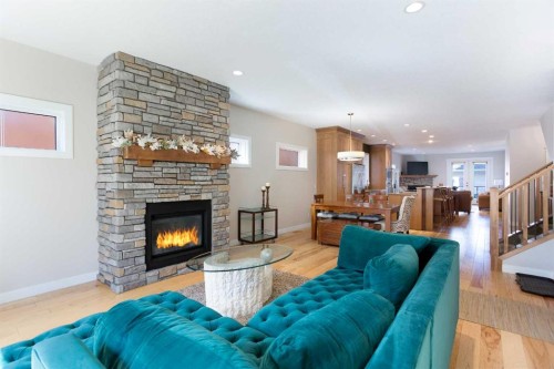 102-814 Memorial Drive Nw, Calgary, AB - Indoor Photo Showing Living Room With Fireplace