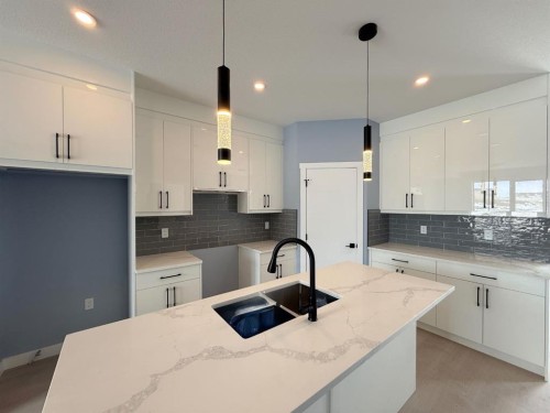 1999 Mccaskill Drive, Crossfield, AB - Indoor Photo Showing Kitchen With Double Sink With Upgraded Kitchen