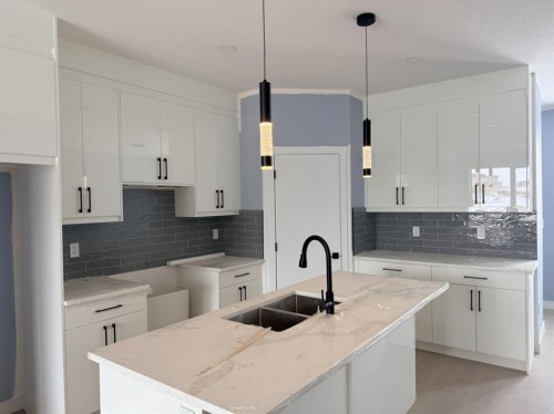 1999 Mccaskill Drive, Crossfield, AB - Indoor Photo Showing Kitchen With Double Sink With Upgraded Kitchen