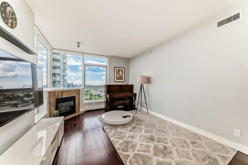 1907-77 Spruce Place Sw, Calgary, AB - Indoor With Fireplace